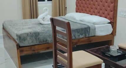 Om residency Room Type - Double Deluxe Ac