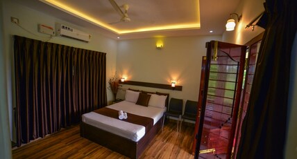 Amritham Holidays | Rooms & Wi-Fi Room Type - AC Double Room with Balcony