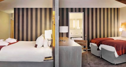 H Room Type - Standard Room with 1 double bed, 3 single bedsand a balcony