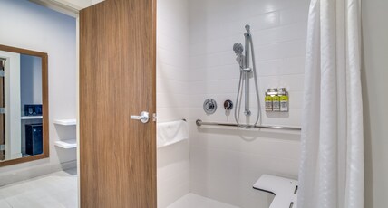 Holiday Inn Express and Suites Denton South Room Type - 1 King Standard Communication Accessible Roll In Shower Holiday Inn Express and Suites Denton South Room Type - 1 King Standard Communication Accessible Roll In Shower