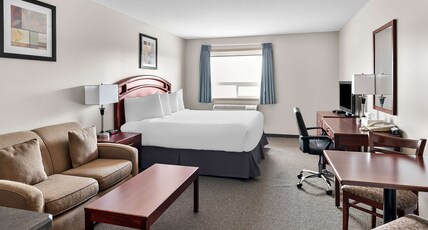 SureStay Plus Hotel by Best Western Hardisty Room Type - 1 King Bed, Non-Smoking, Flat Screen Television, Separate Sitting Area, Love Seat, Microwave And Ref SureStay Plus Hotel by Best Western Hardisty Room Type - 1 King Bed, Non-Smoking, Flat Screen Television, Separate Sitting Area, Love Seat, Microwave And Ref