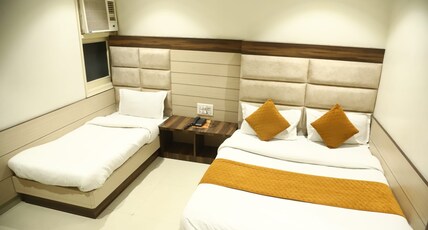 Malhotra Inn (2 min walk from the Golden Temple) Room Type - Deluxe Triple bedroom