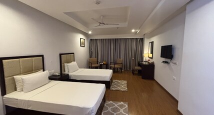 Triguna Clarks Inn Kurnool Room Type - Premium Room with City view and Twin Bed