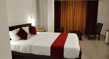 Happy Homes Vellaramkunnu Room Type - Deluxe Rooms