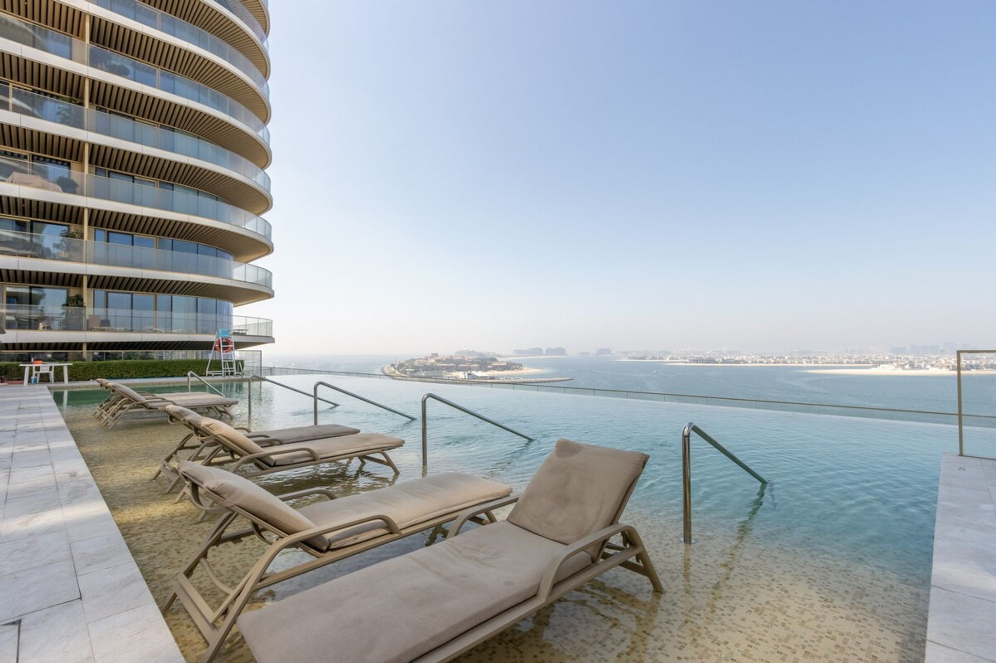 ELIVAAS Curated Designer 1BR at Emaar Beachfront | Beach Acces - Tap to explore photos