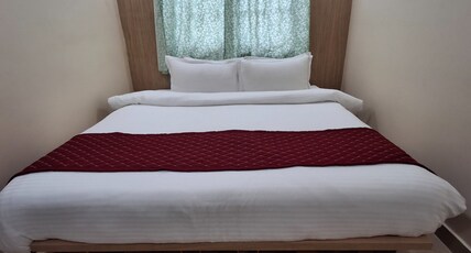RAVIKA GRAND HOTEL AND BANQUET Room Type - Deluxe Room