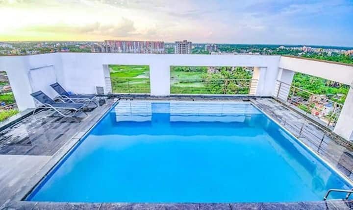 Luxury Studio near Airport with pool & Gym - Tap to explore photos