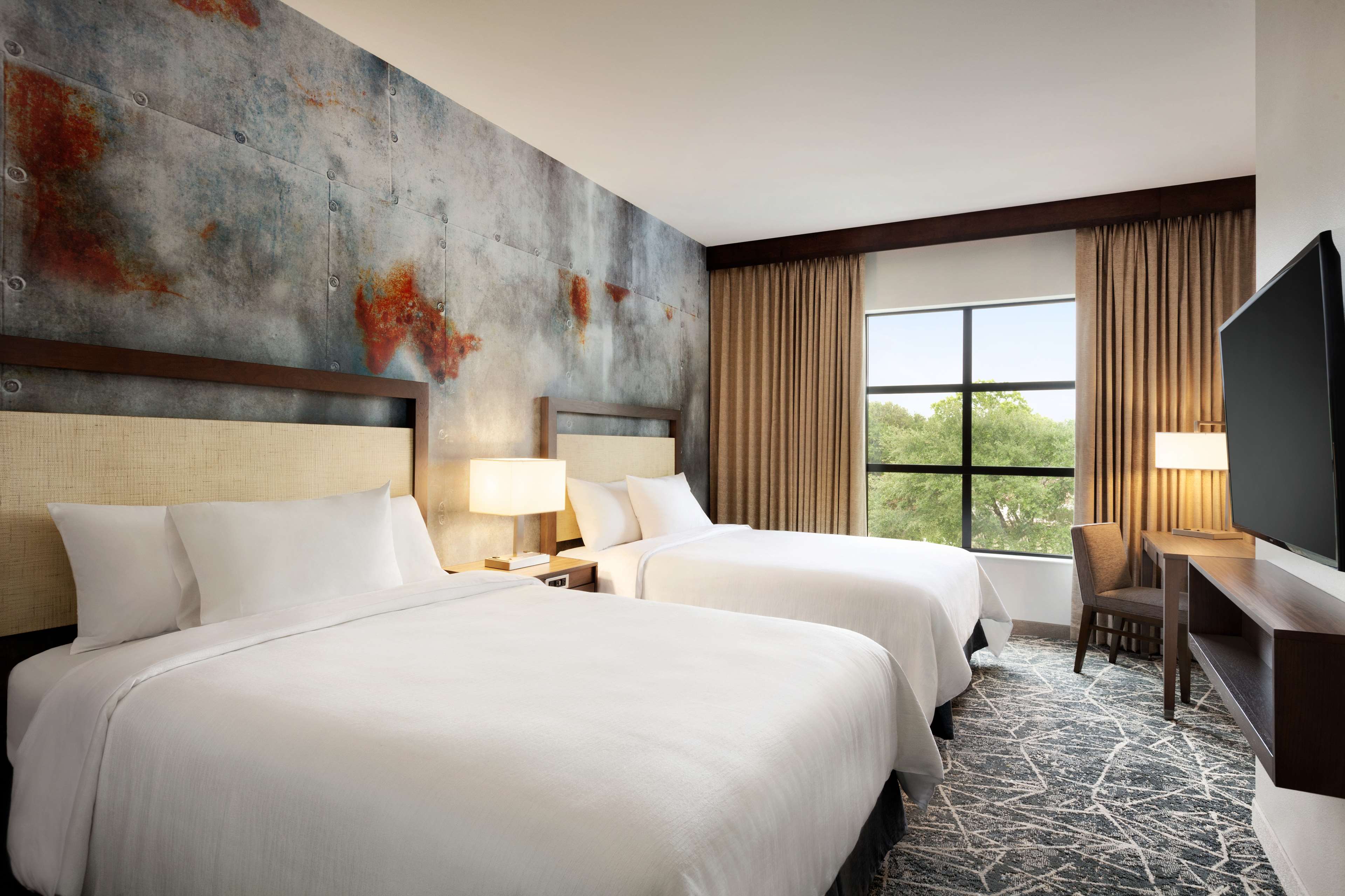 Embassy Suites by Hilton San Antonio Brooks Hotel & Spa - Tap to explore photos