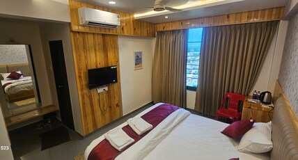 OMTEL HOTEL RESTAURANT Room Type - Deluxe Room Ac