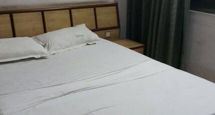 LAND MARK INN Room Type - Deluxe AC Room