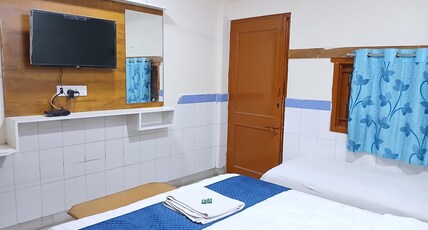 YOGESHWAR Room Type - Deluxe Triple Room