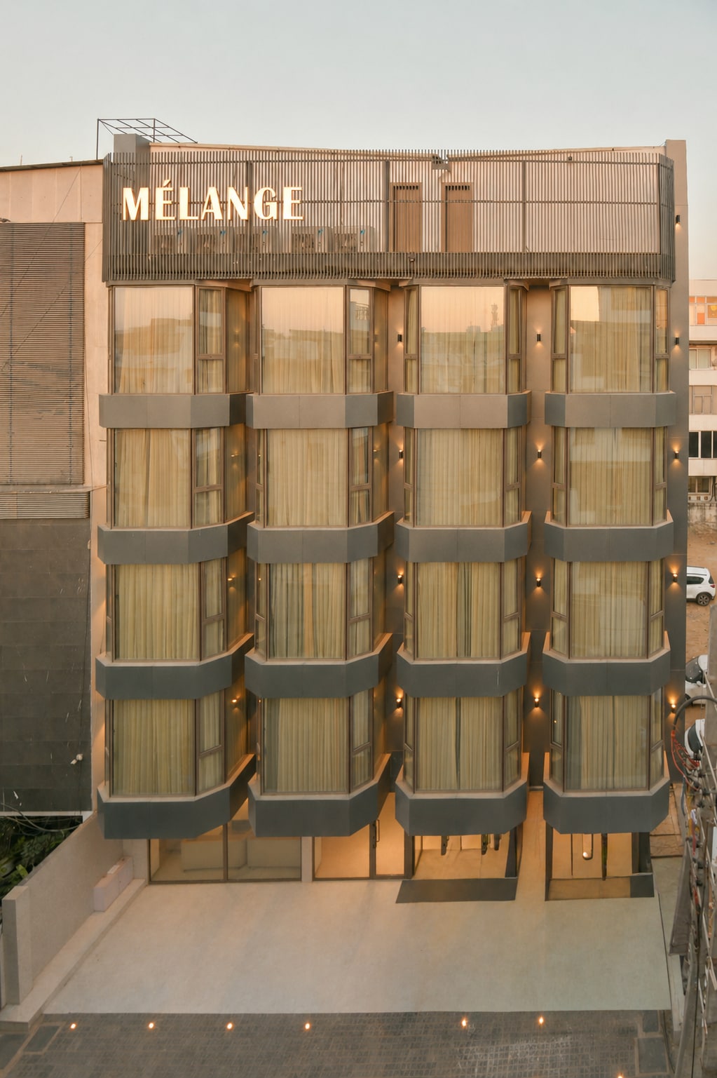 Melange Hotel - Golf course road - Tap to explore photos