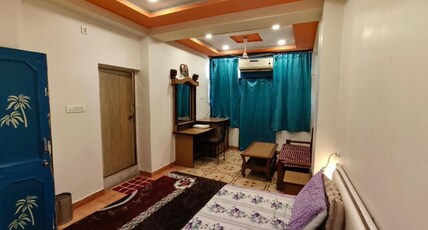 Shivam Guest House Room Type - Deluxe Room with Balcony Shivam Guest House Room Type - Deluxe Room with Balcony