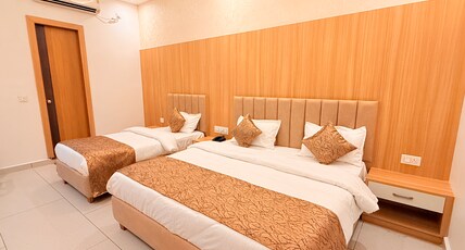 Aaravya Hotels & Banquets Room Type - Deluxe Room (Triple Bedded)