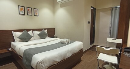 SUNBRIGHT ROOMS & RESIDENCY Room Type - DELUXE ROOM