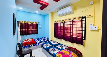 BALAJI LODGE Room Type - Twin Bed AC with Sharing Bathroom