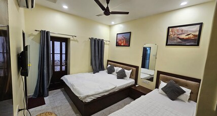 Ganga Sparsh | Near Kashi Vishwanath Temple Room Type - Triple Bedded | Attached Balcony