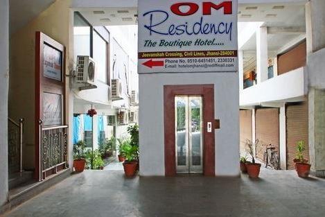 Hotel Om Residency - Tap to explore photos