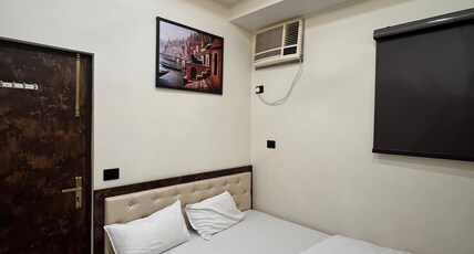 Hotel Divyakashi Room Type - Deluxe Room