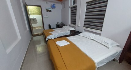 Karthika Homestay Room Type - Family room with Two Queen Size cots.