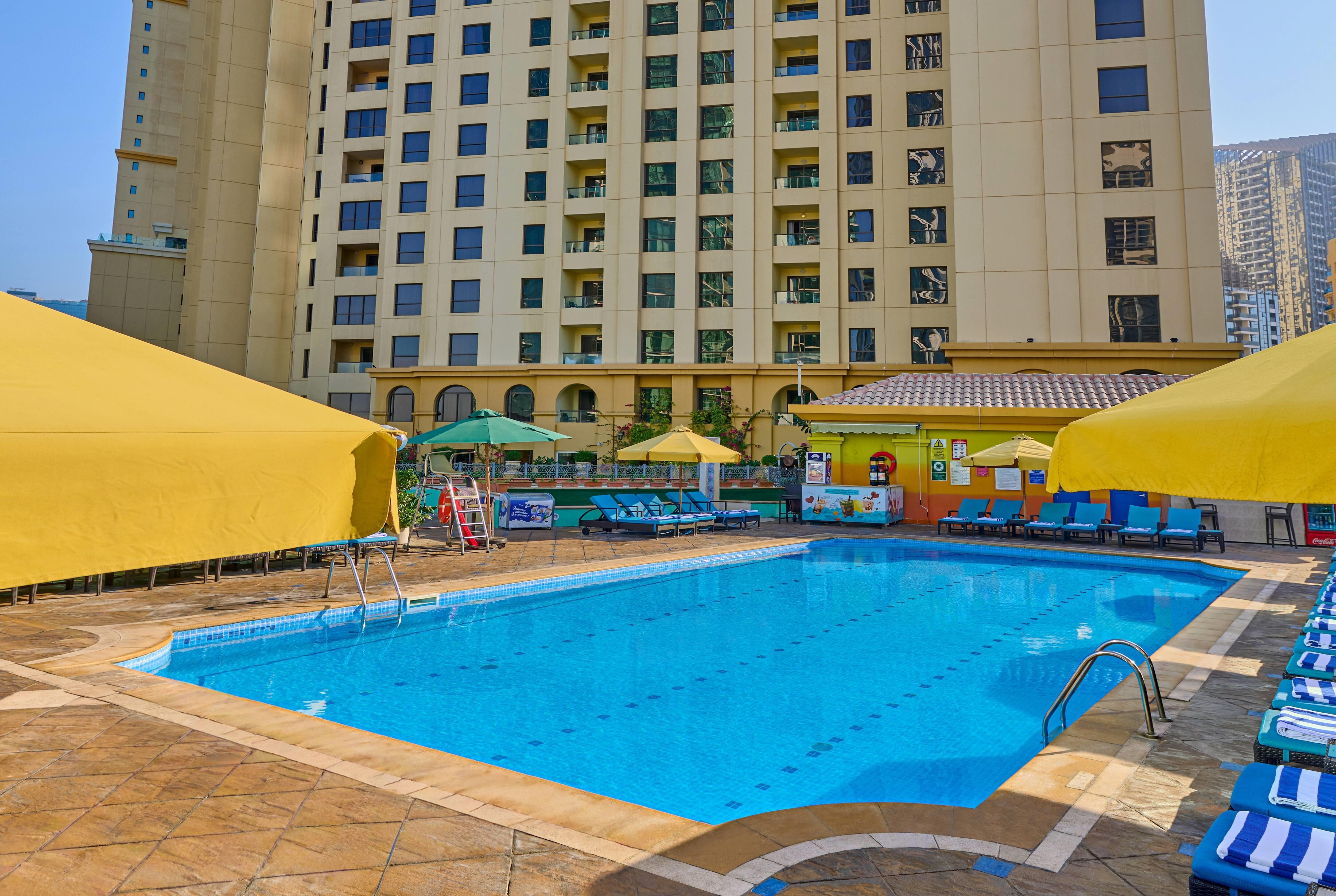 Ramada Hotel and Suites by Wyndham JBR - Tap to explore photos