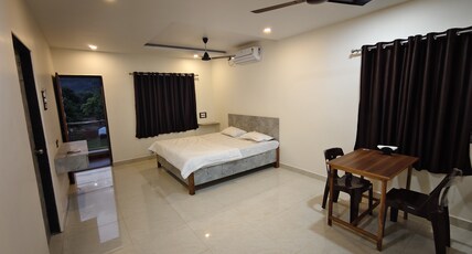 Krushnai Farm stays Room Type - Master room with king size bed