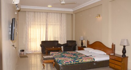 Pooja International Room Type - Super Deluxe Room AC