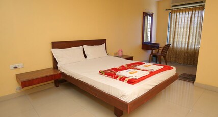 Malar Residency Room Type - Deluxe Room AC