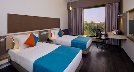 Pride Biznotel Manjusar Room Type - Deluxe Room (Garden view Room )