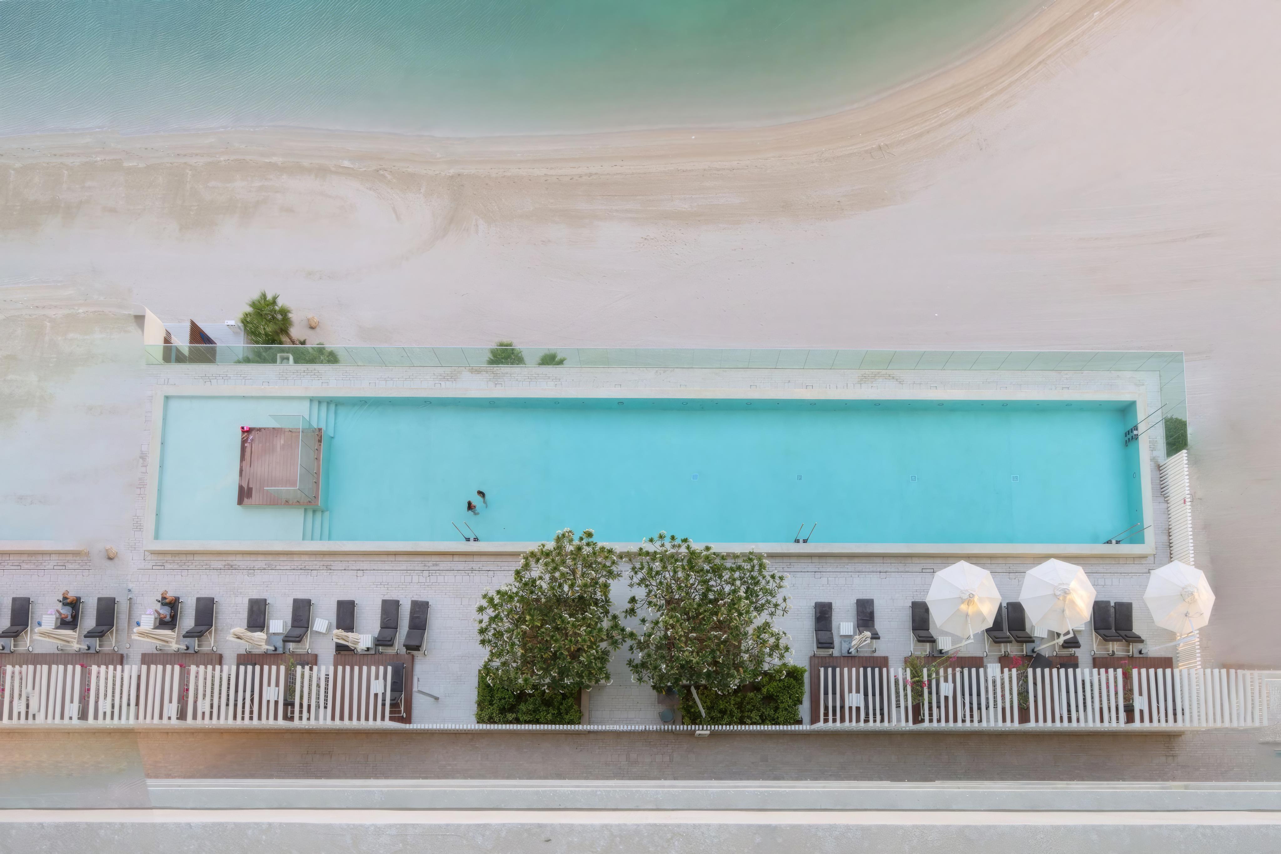 ELIVAAS Curated 2BR Beachfront Living, Stunning Marina Views - Tap to explore photos