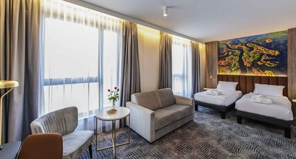Mercure Bialystok Room Type - Twin Privilege Room with two single beds and a sofa bed