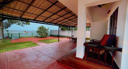 ILLIKKALAM LAKESIDE COTTAGES Kumarakom Kerala Room Type - Lake Front Sunset View AC Villa For 3 Persons