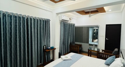 Enroute Delight Residency Kothamangalam Room Type - Deluxe Family Room