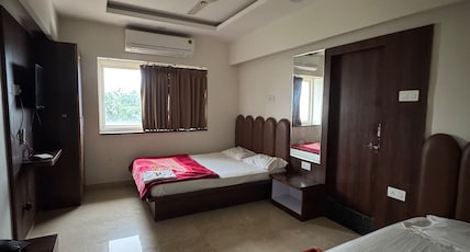 Hotel Sheetal Palace Room Type - 4 bed Deluxe AC Room Hotel Sheetal Palace Room Type - 4 bed Deluxe AC Room