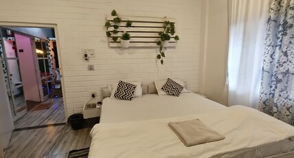 Swargadeo Inn Room Type - WHITE STUDIO ONE RK AC UNIT