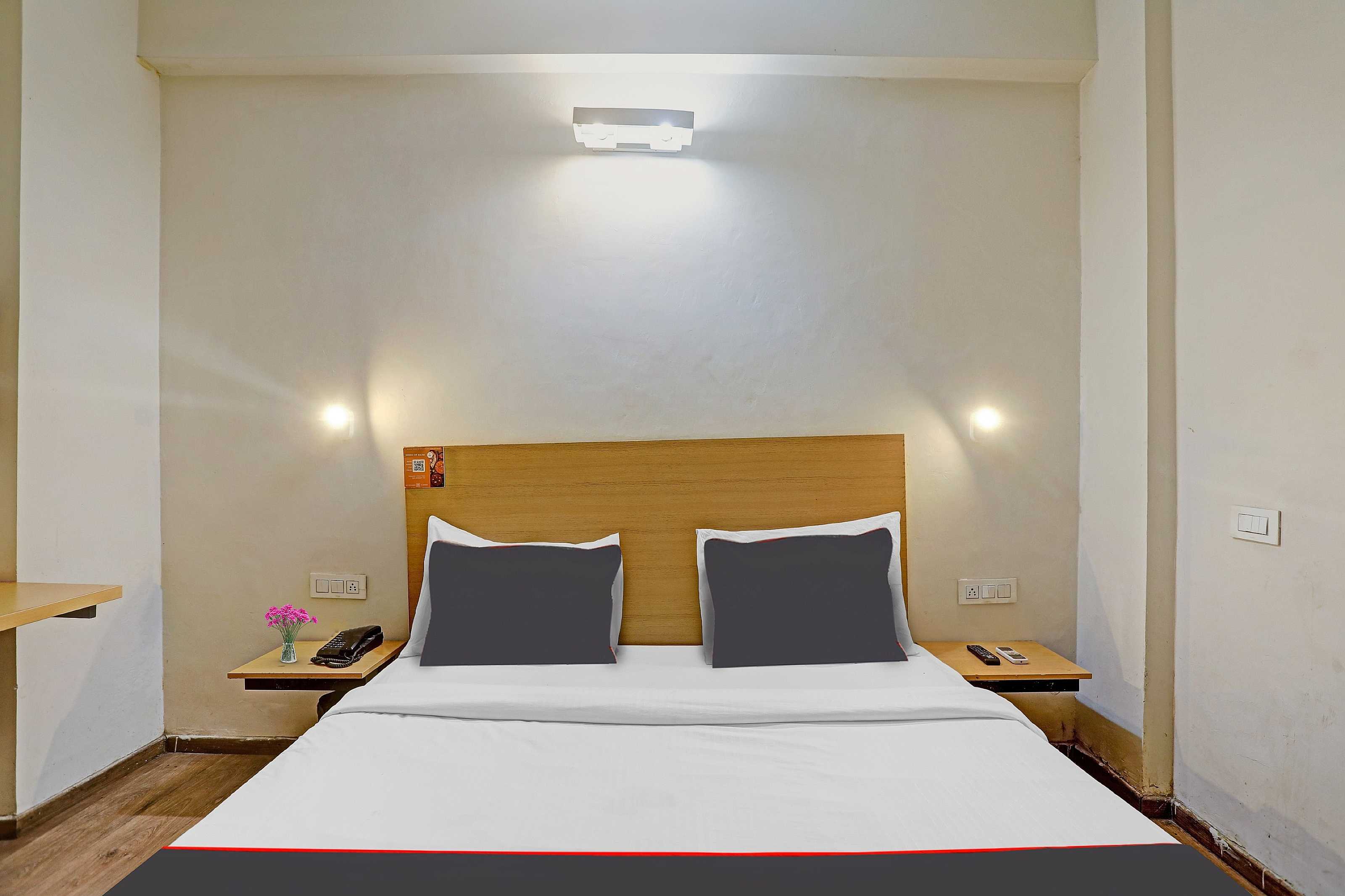 Capital O Mt Corporate Stays Near Iskcon Temple Noida - Tap to explore photos