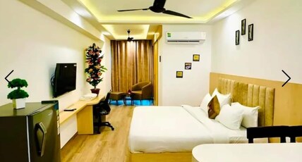 the grand anukampa hotel nitya studio apartments Room Type - Delux room 