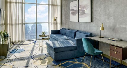 PULLMAN SHARJAH Room Type - Executive Suite with King Size Bed and Living Room - City View