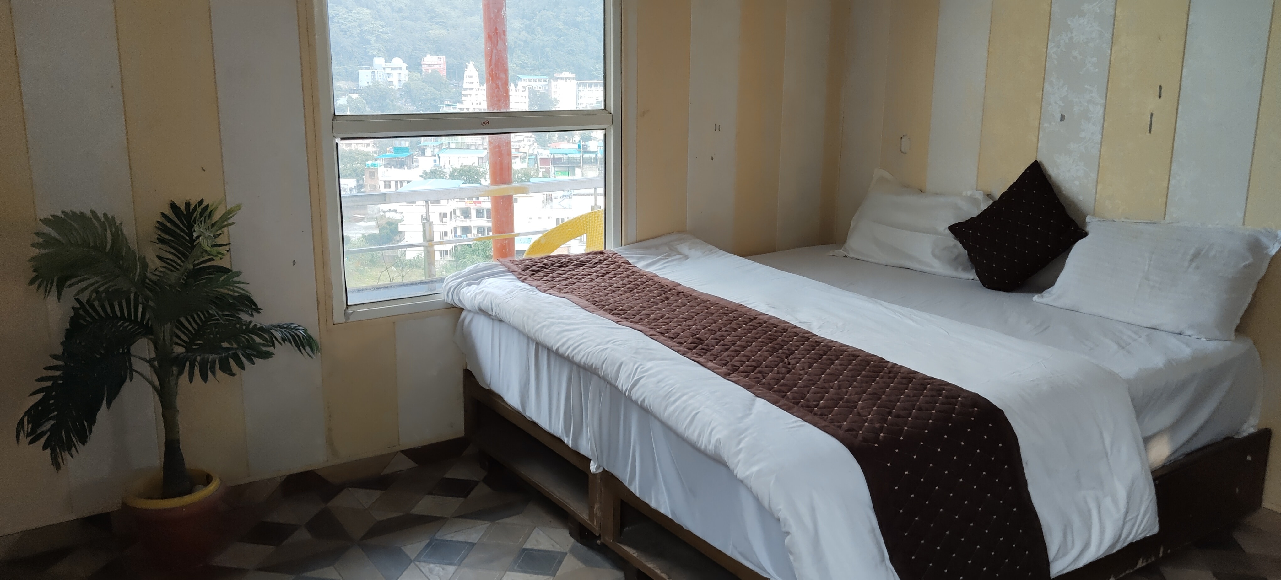 Hotel Nirvana By GuestLo - Tap to explore photos