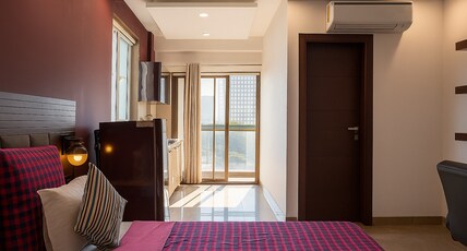 Perch Service Apartments | DLF Cyber City Room Type - Sterling Studio Apartment (with balcony)