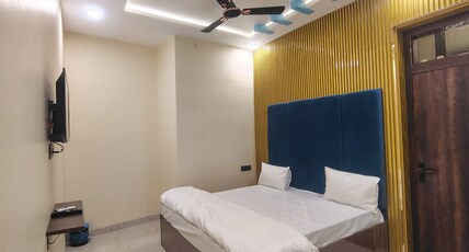 Pushpanjali Grand Inn Room Type - Deluxe Room