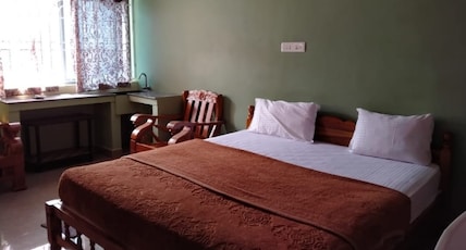 Aruvi Cottages Room Type - Deluxe room with King bed Aruvi Cottages Room Type - Deluxe room with King bed