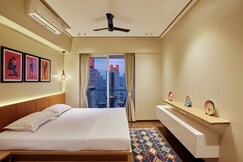 Luxurious suite with city skyline views  Kutumb