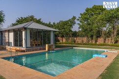 StayVista at Kaimalgarh Aravalli Estate with Pool & Lake view