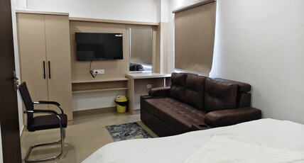 Vaishnavi Grand Room Type - Bedroom 202