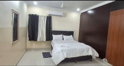 Happy stays Elite  Room Type - Deluxe Deble Room