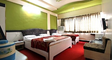 Hotel Tourist International Room Type - Super Deluxe AC