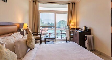 Antarman Stays l Riverside Room Type - Premium Room With Balcony