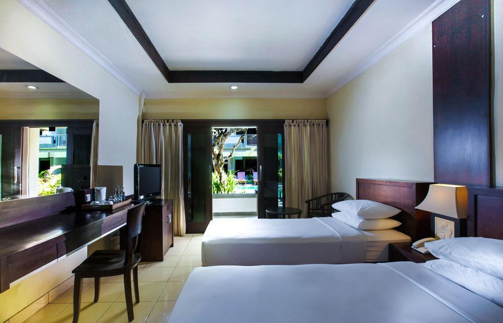 Champlung Mas Hotel Legian - Tap to explore photos