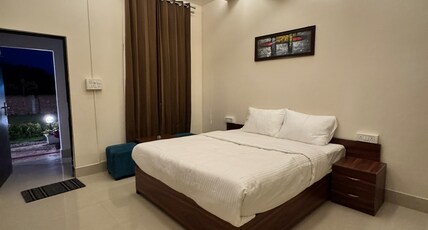 Eshanya Stays Room Type - Deluxe Room with Garden View